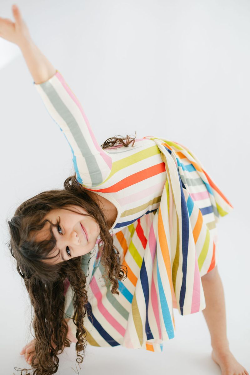 Bright striped 3/4 sleeve twirl dress by Good Apples, featuring a playful, colorful design perfect for casual wear.