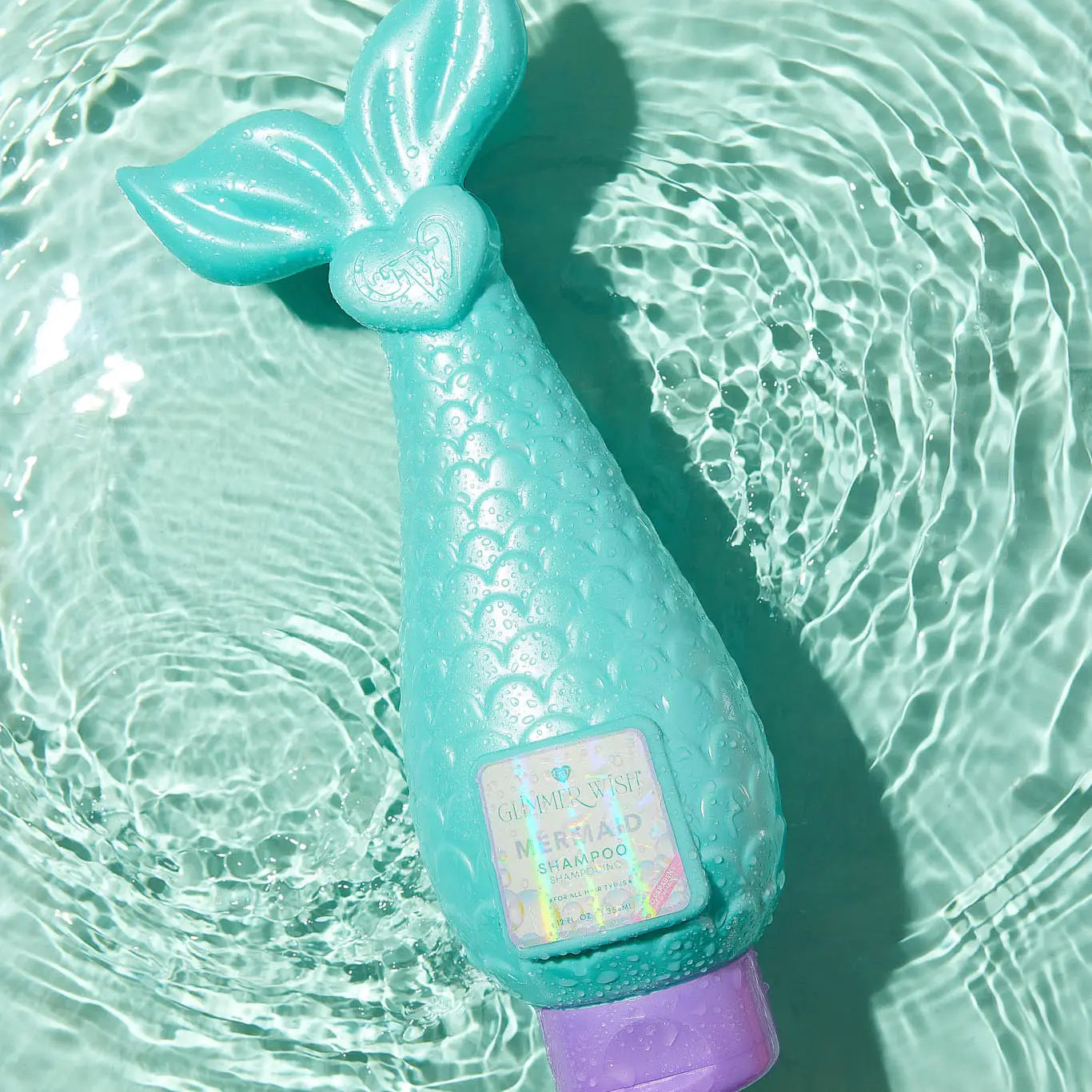 Glimmer Wish Mermaid Kids Shampoo by Sweet E's Children's Boutique, paraben and sulfate free, with colorful mermaid-themed packaging.