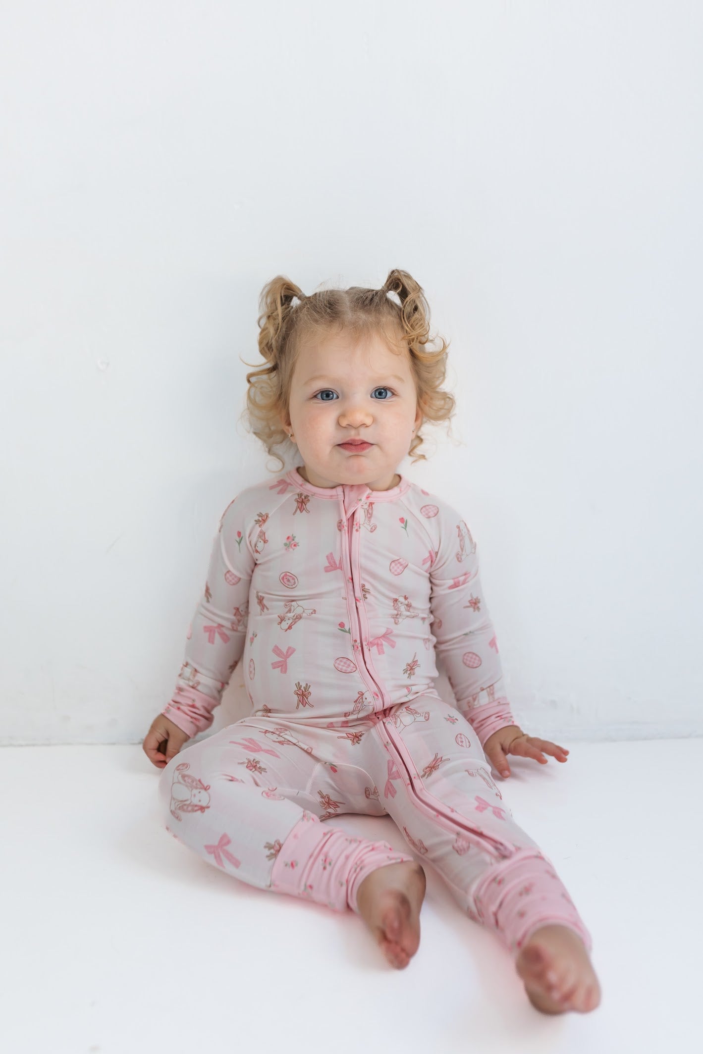 In My Jammers Rosie Rabbit zipper romper for infants, featuring a cute bunny print and a front zipper closure.