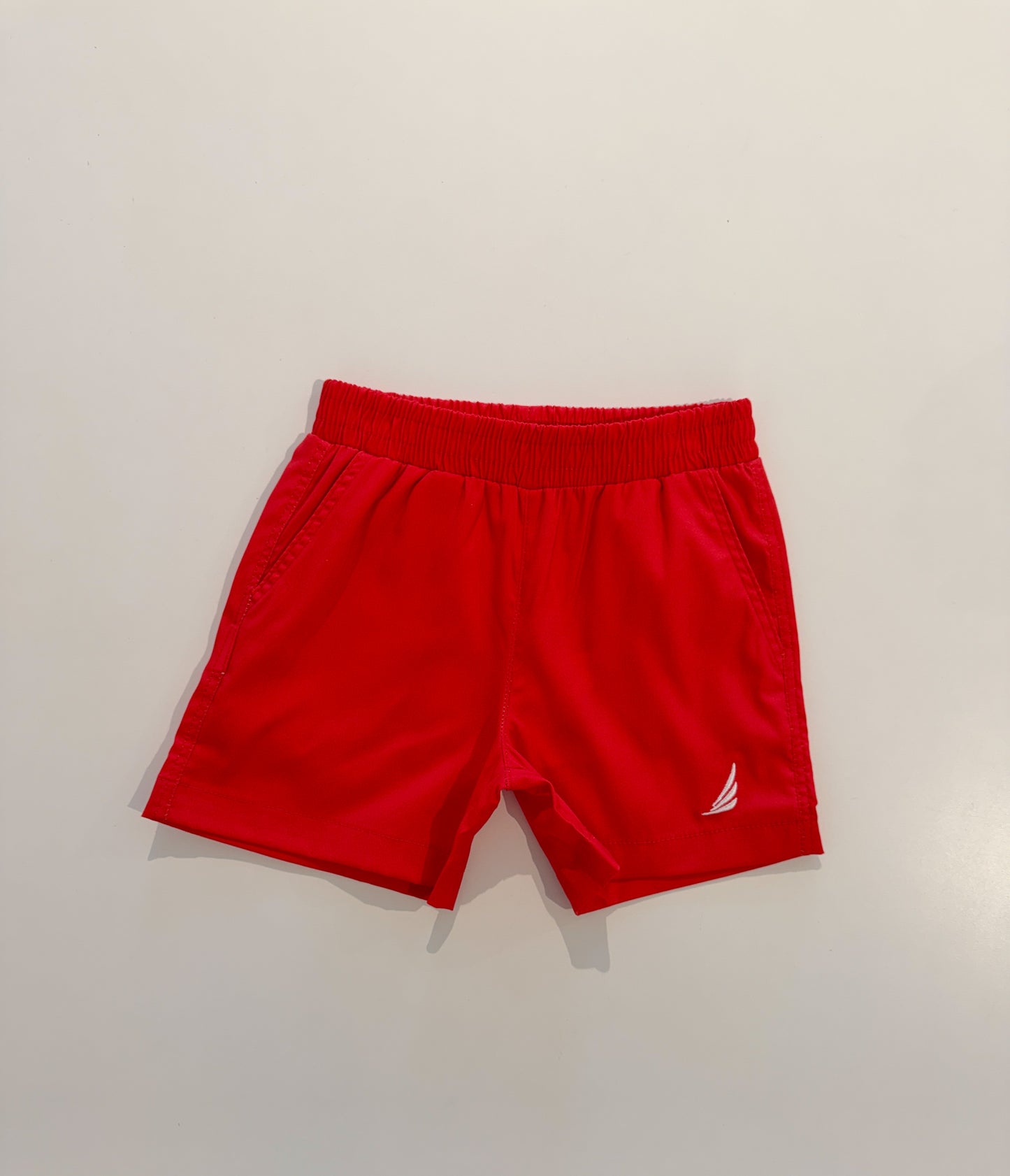 Solid red River Performance short by Coolybri, featuring a comfortable fit and athletic design, shown on a model.
