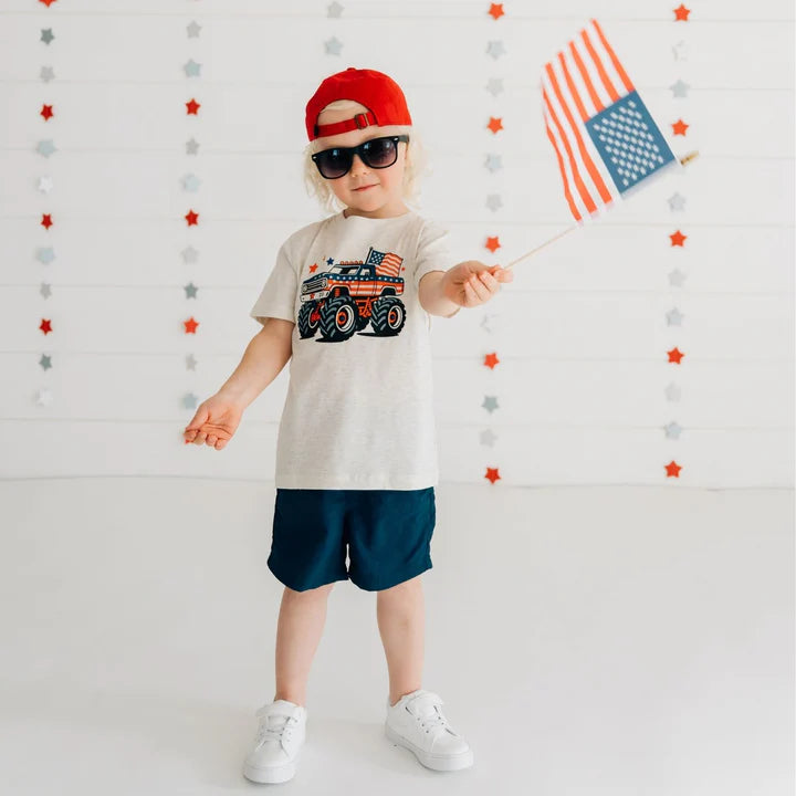 Model wearing Sweet Wink American Monster Truck short sleeve T-shirt in natural heather, showcasing casual fit and truck graphic.