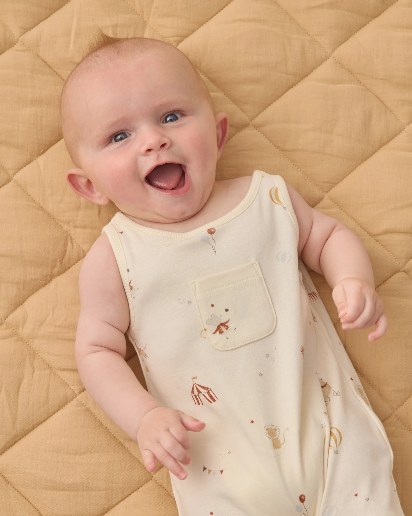 Quincy Mae Carnival sleeveless one-piece in soft fabric, shown on a child, with playful ruffle details and shoulder straps.