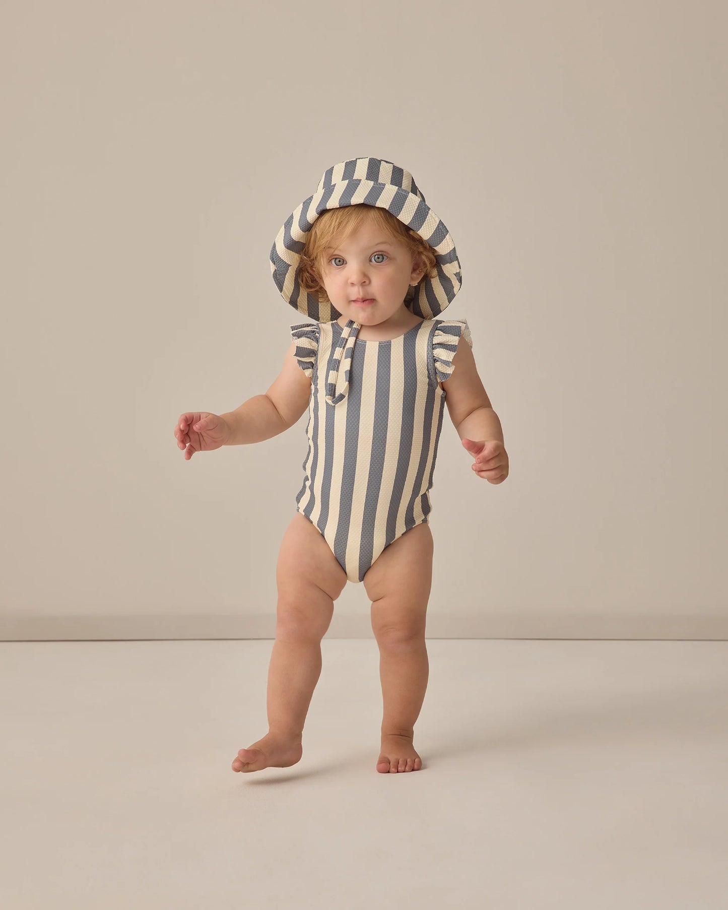 Retro ocean stripe scoop back one-piece swimsuit by Quincy Mae, featuring a vibrant blue and white striped pattern and classic fit.