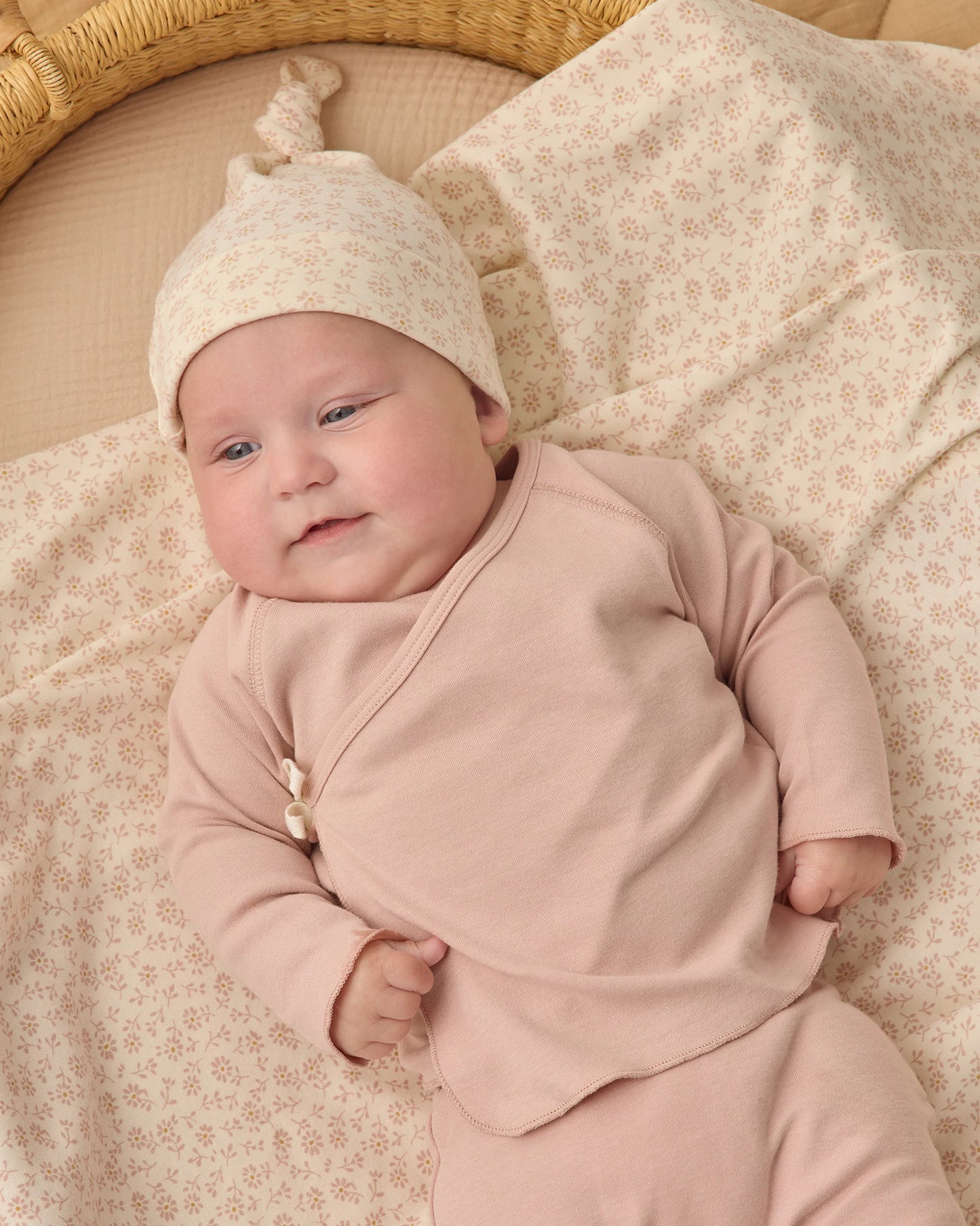 Quincy Mae blush wrap top with long sleeves paired with matching footed pants, soft and comfortable toddler clothing set.