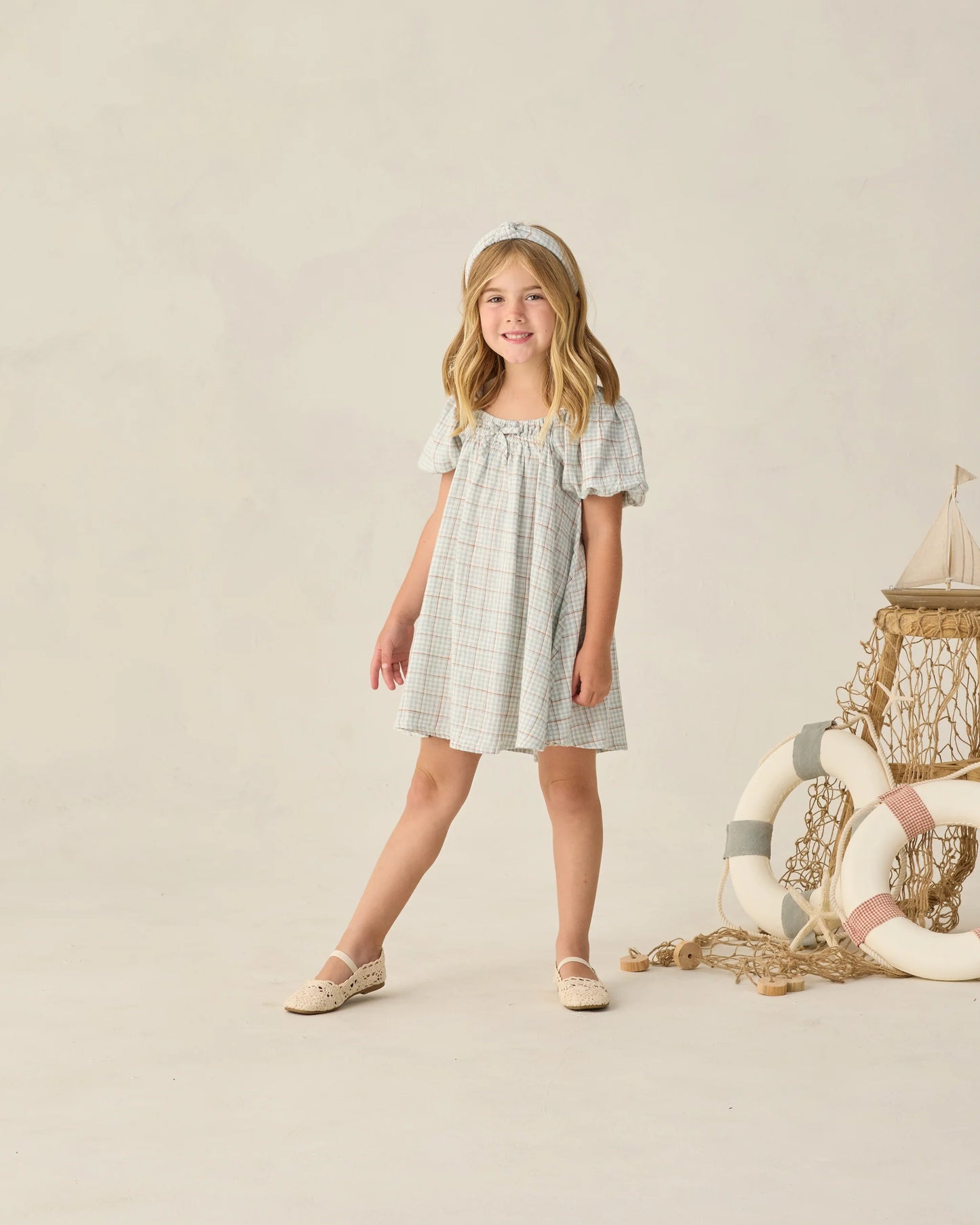 Light blue plaid Sabrina mini dress by Rylee & Cru, featuring a fitted bodice and short sleeves, displayed on a mannequin.