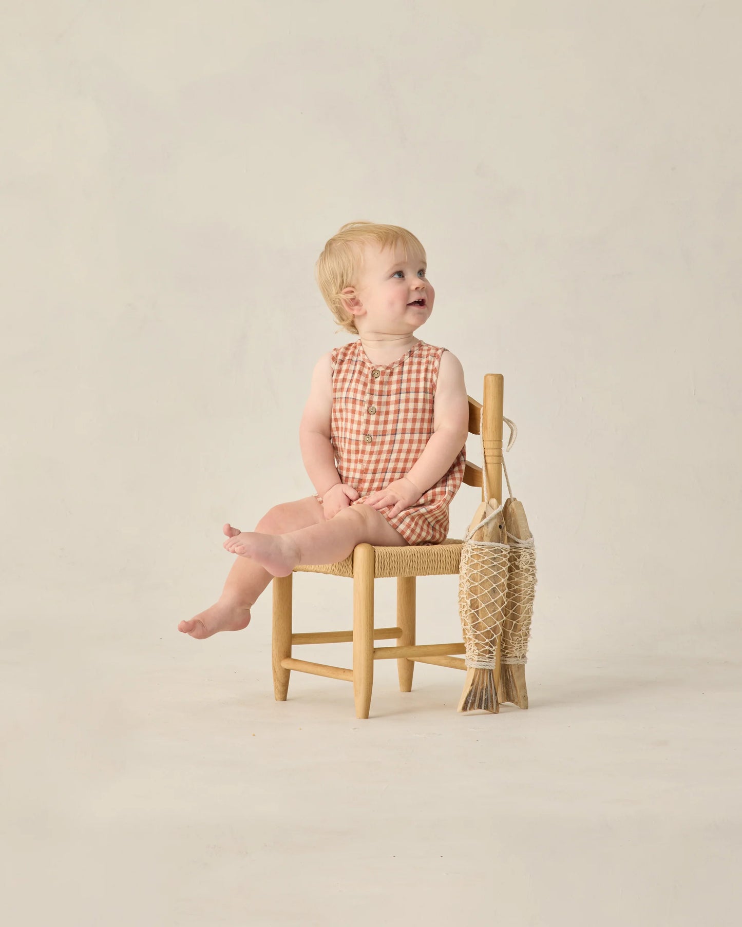 Rylee & Cru Poppy Gingham Mavrick Romper for babies, featuring a red and white checkered pattern and short sleeves.