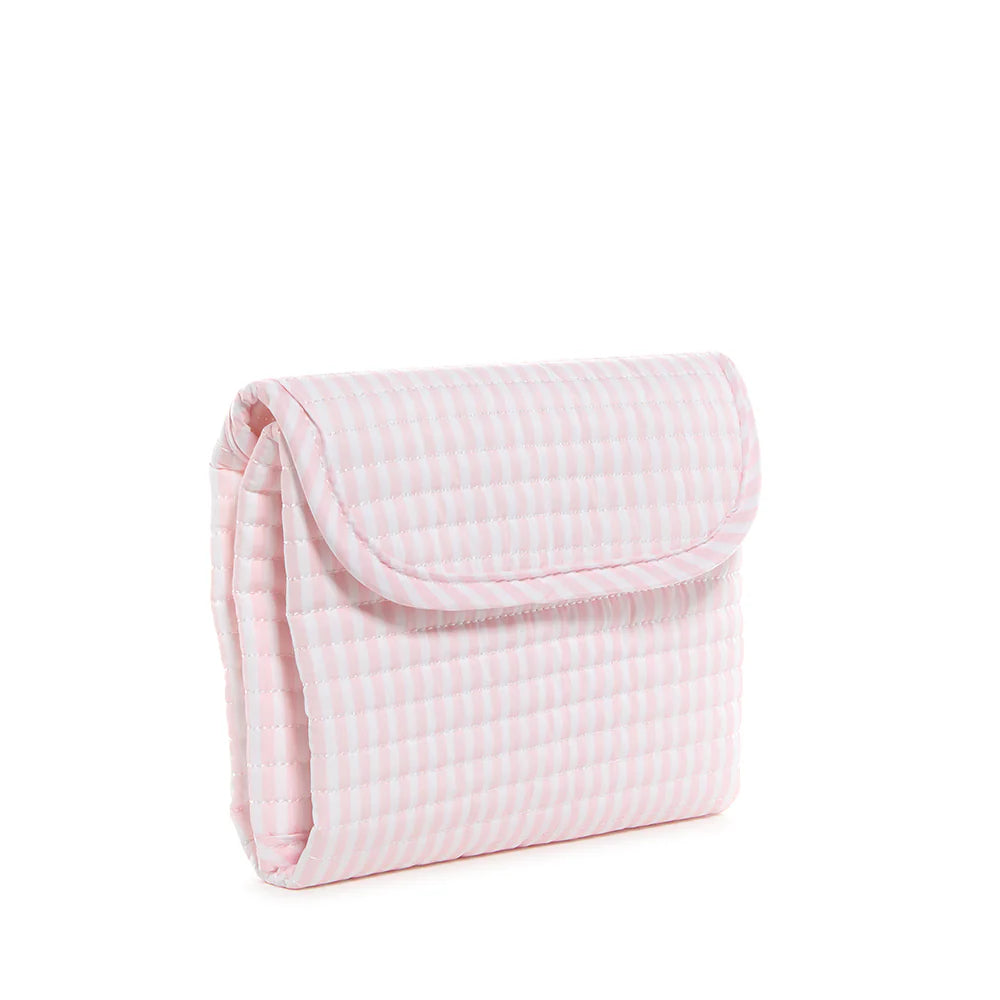 Pink quilted changing mat by TRVL Designs with Pimlico Stripe pattern, soft padded surface for baby diaper changes.