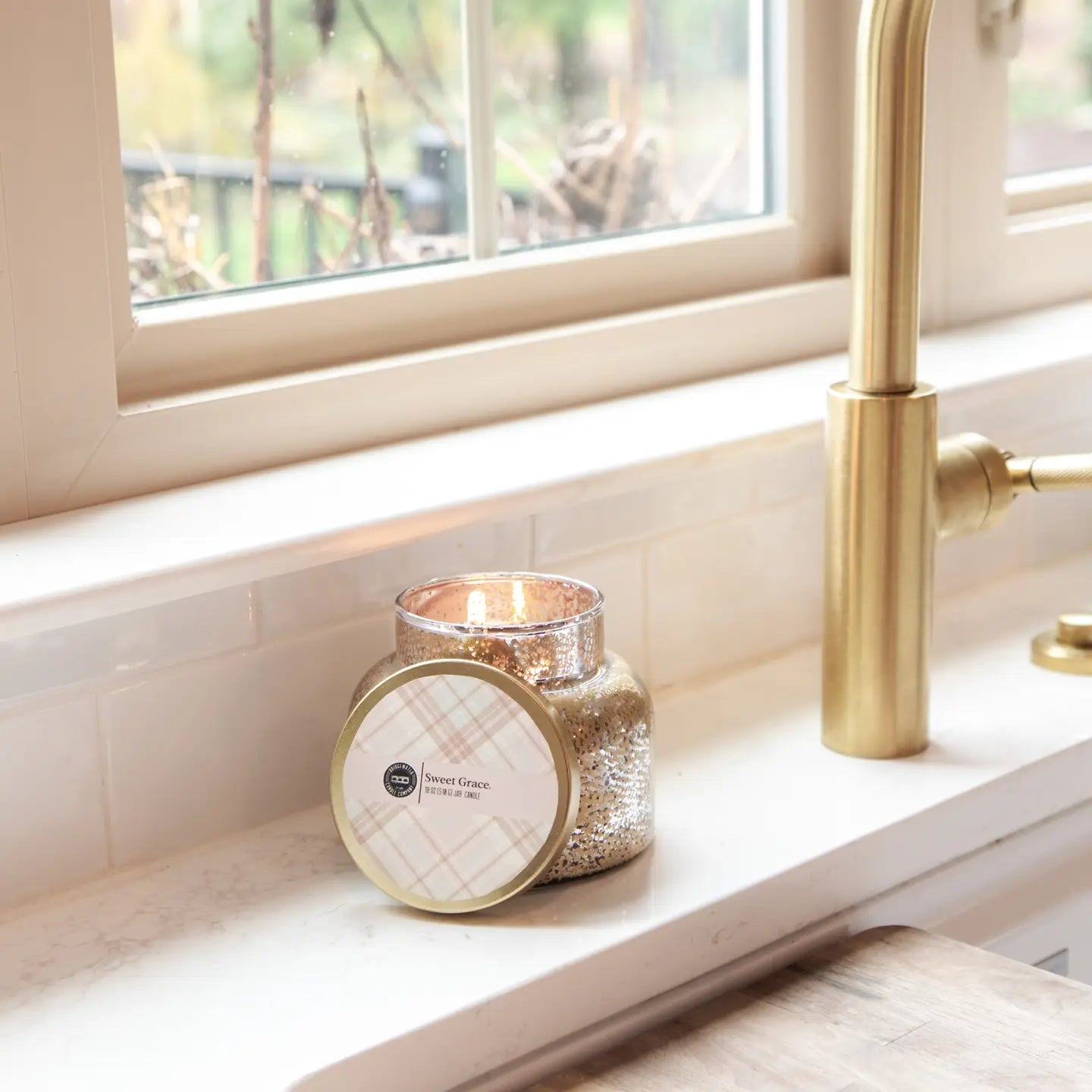Bridgewater Candle Company Sweet Grace Mercury Jar Candle with elegant glass container and soft candlelight.