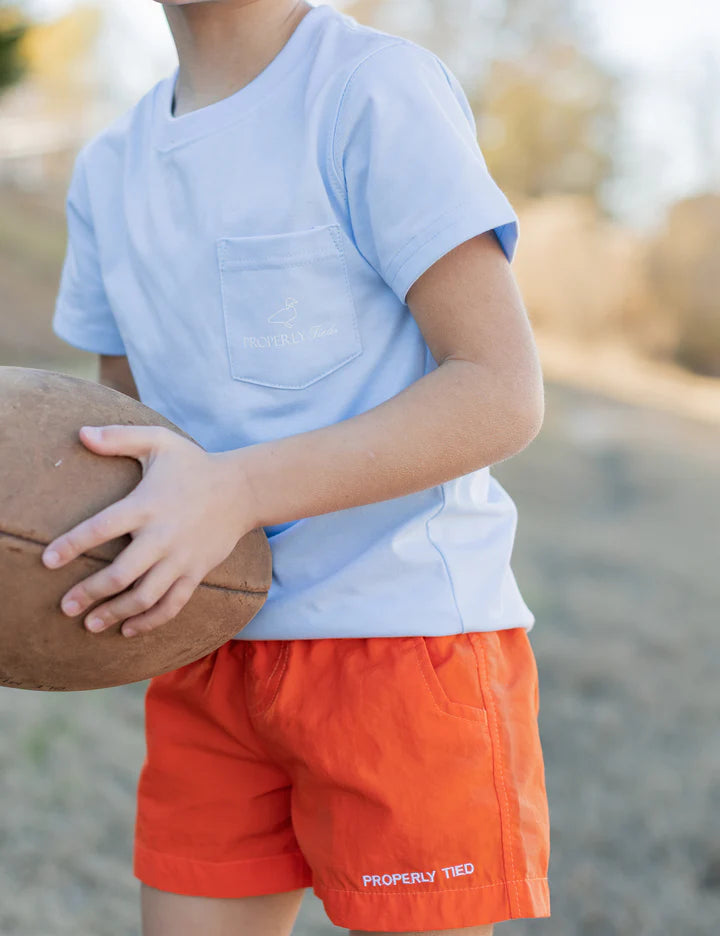 Bright orange boys' mallard shorts by Properly Tied, featuring a comfortable fit and casual style perfect for warm weather.