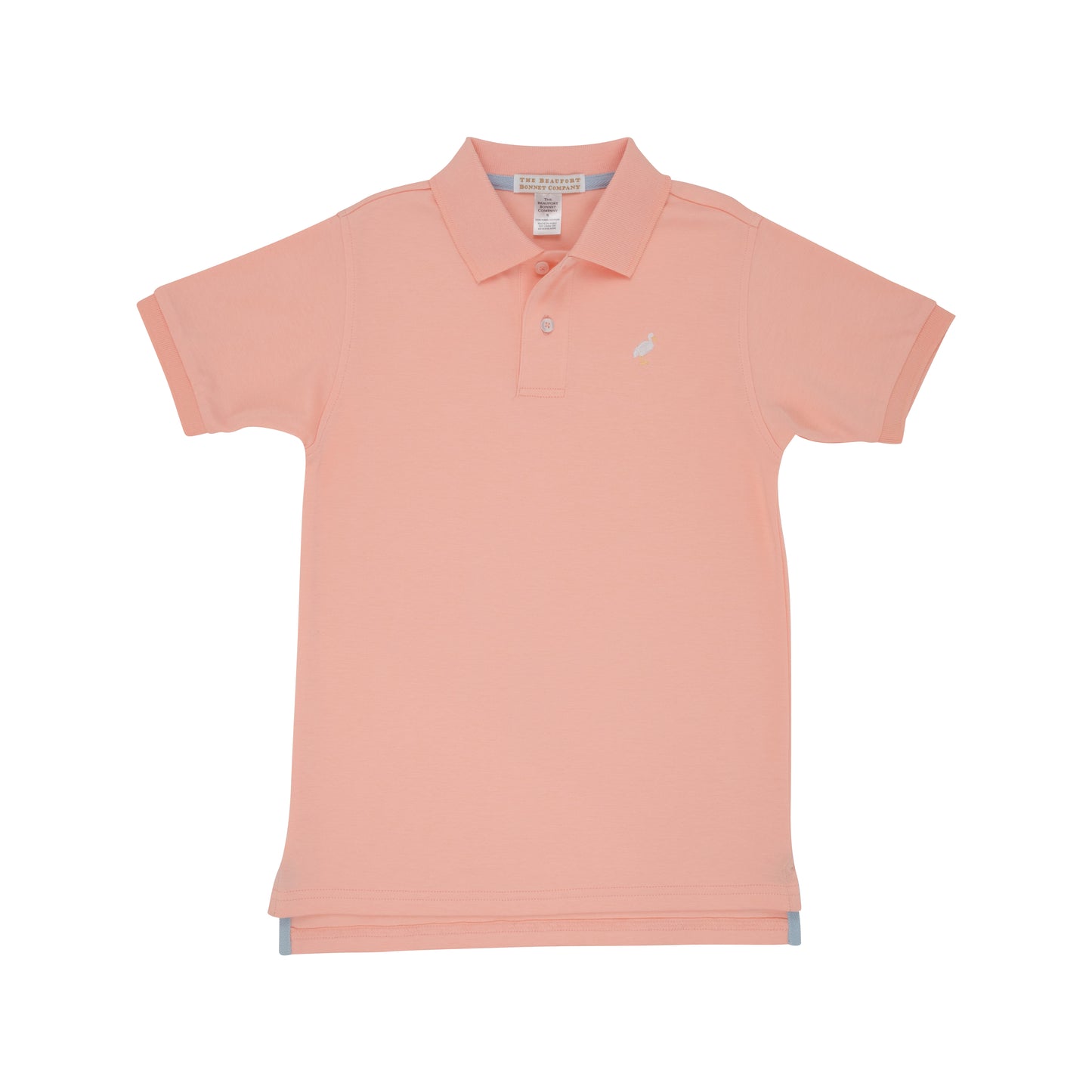 Pompano Peach Prim and Proper Polo shirt for children by The Beaufort Bonnet Company, featuring a peach-colored polo with subtle detailing.
