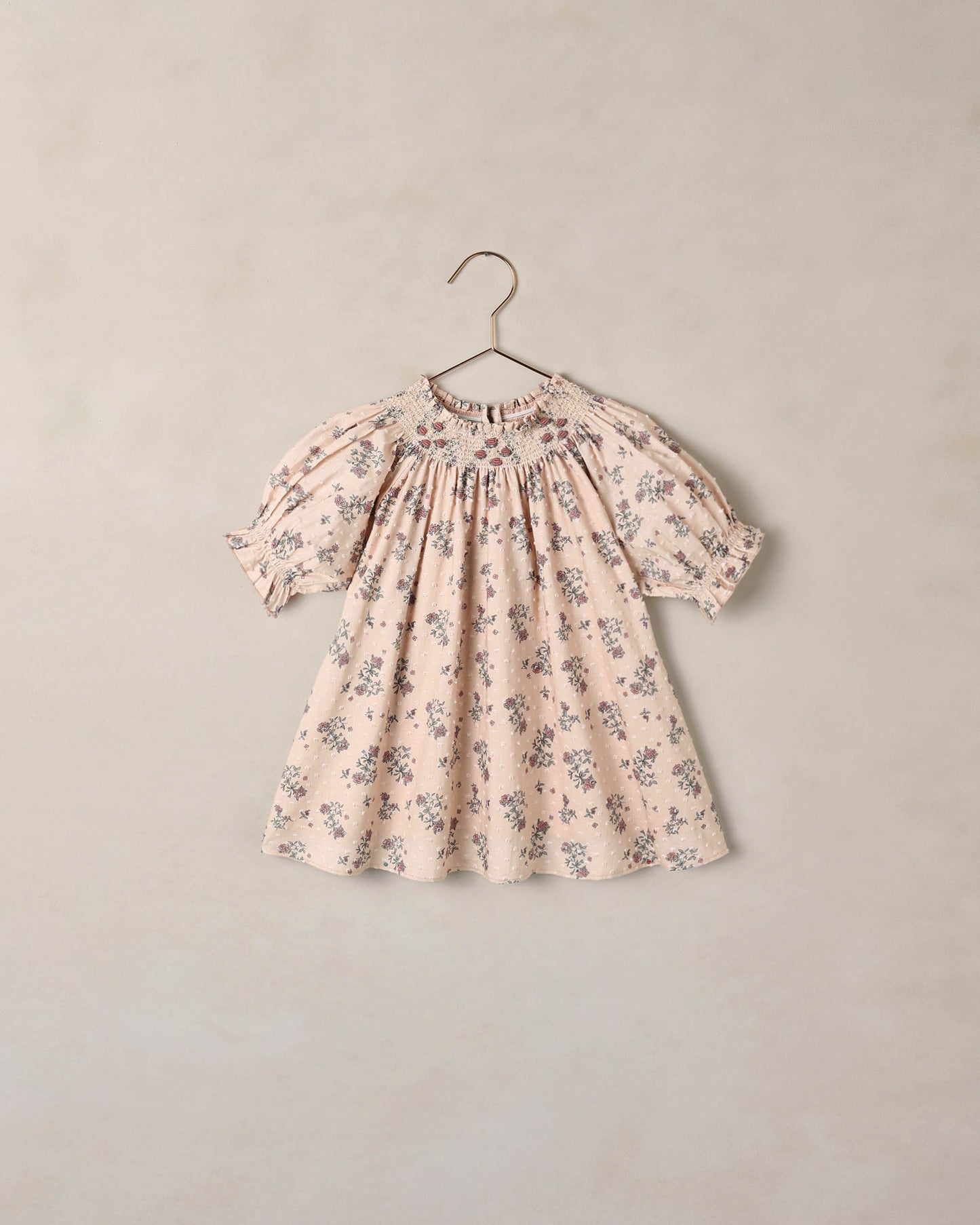 Noralee French Floral Maddie Dress featuring a vibrant floral pattern and flowing fabric, perfect for summer or casual wear.