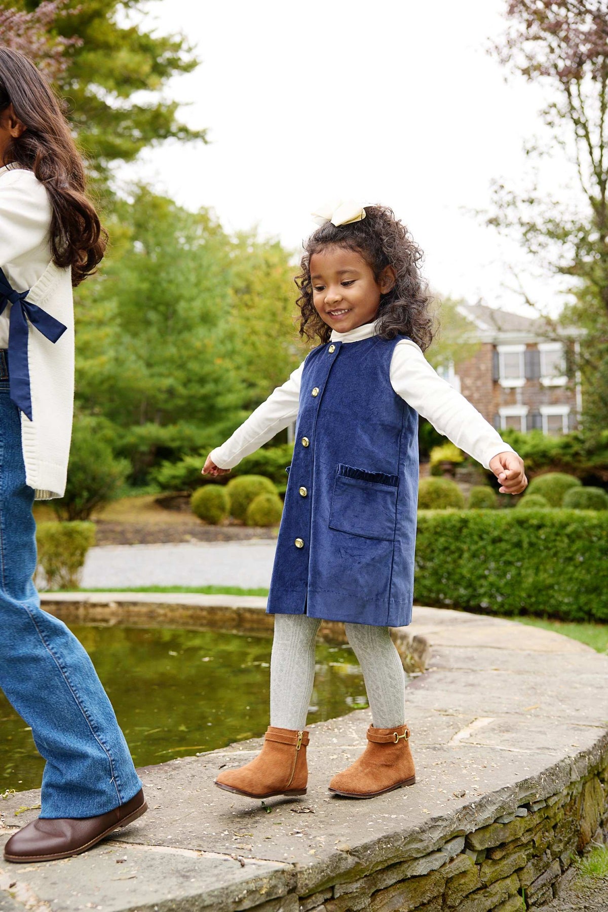 Nantucket Navy Jilly Jumper by The Beaufort Bonnet Company, featuring a cozy navy knit sweater with cute details and ribbed cuffs.
