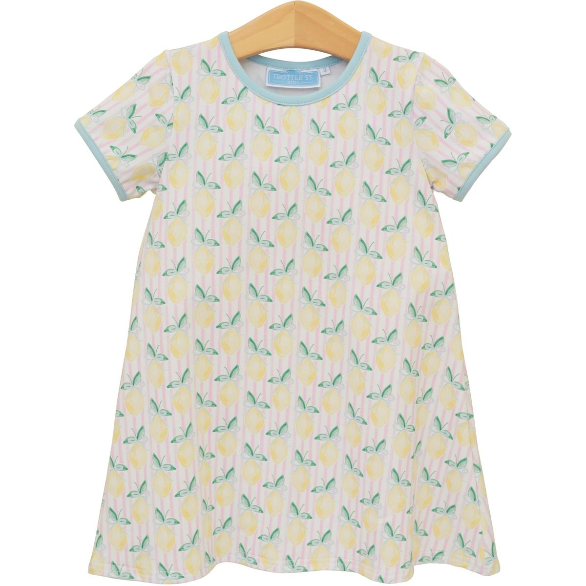 Trotter Street Squeeze the Day Dress in vibrant fabric, displayed hanging with a fitted silhouette and stylish design.