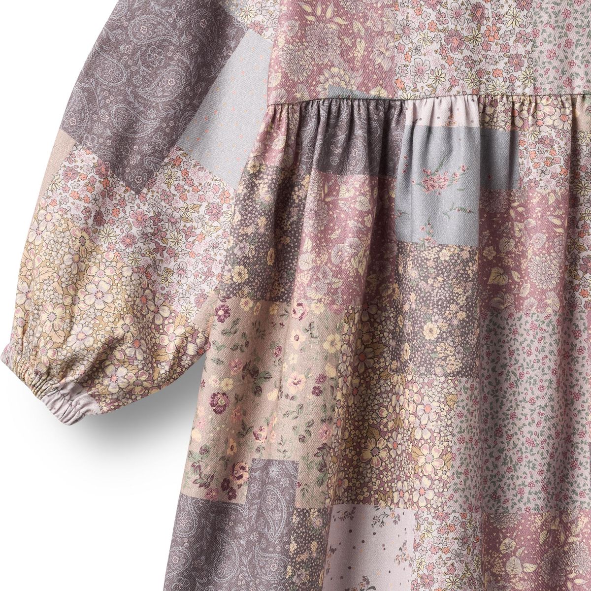 Long sleeve Patchwork Flowers Herdis dress by Wheat featuring colorful floral patchwork fabric and a relaxed fit.