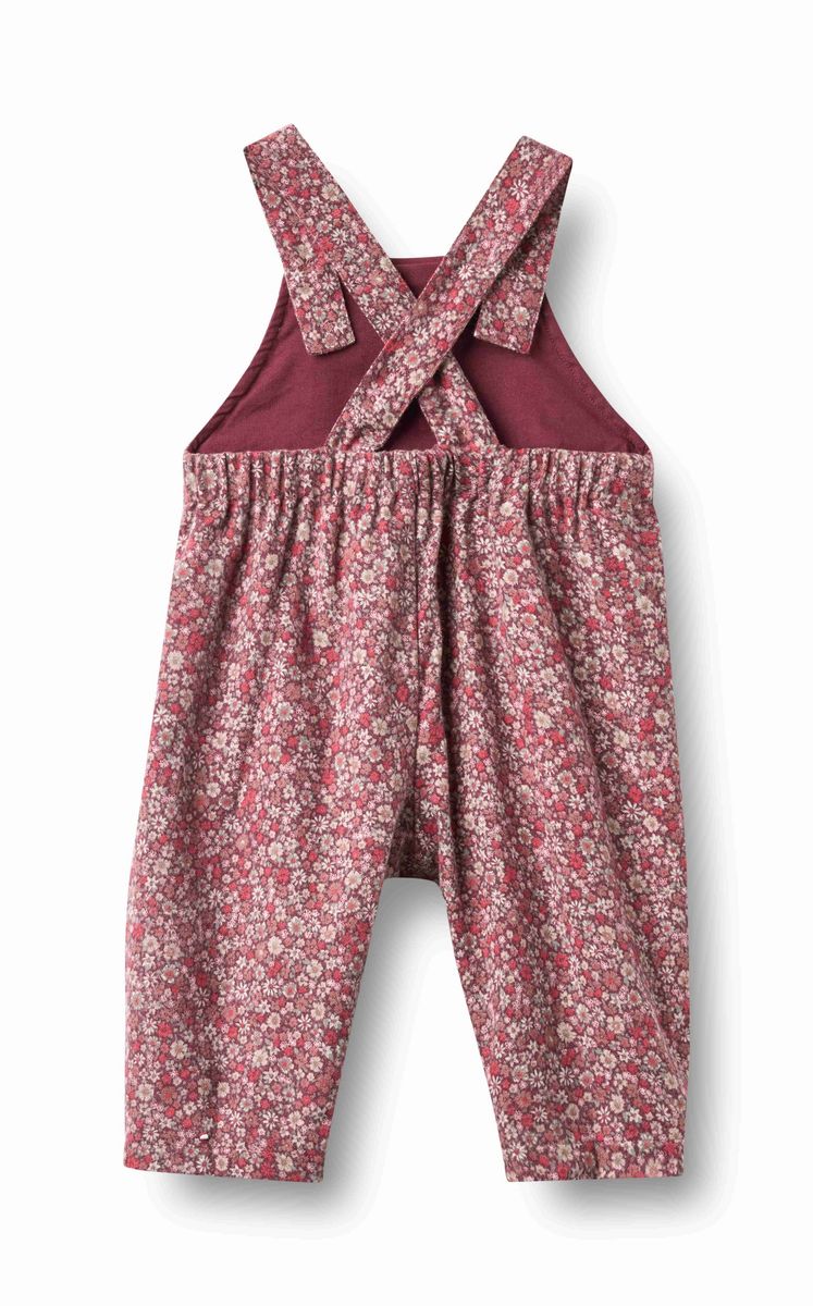 Wheat Grape Flowers Liz Overalls featuring a colorful floral print, denim straps, and pockets on a light background.