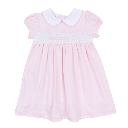 Pink Magnolia Baby big sister smocked short-sleeve toddler dress with ruffled details and delicate embroidery.