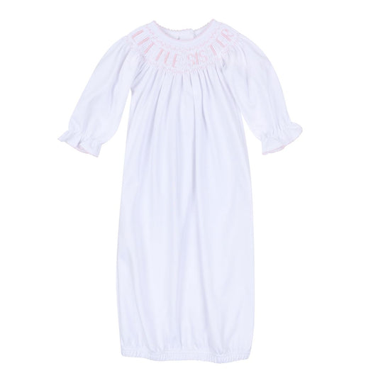 Pink Little Sister Bishop Gown by Magnolia Baby, soft fabric with delicate details, perfect for special occasions or photos.