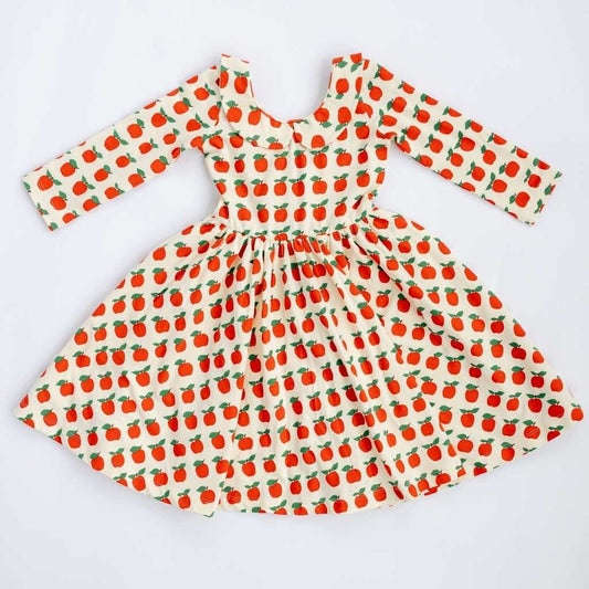 Red 3/4 sleeve twirl dress with apple print and collar by Good Apples, showcasing a playful, feminine design.