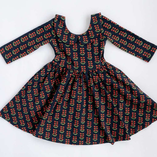 Navy floral 3/4 sleeve twirl dress with collar by Good Apples, showing a flowing, patterned dress on a model.