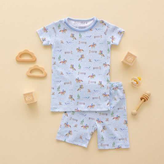 Little Wranglers short pajamas for kids by Luna + Arlo, featuring colorful cowboy and animal print on soft fabric.