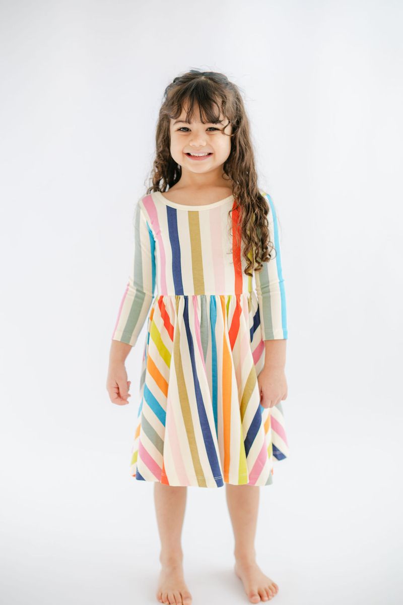 Bright striped 3/4 sleeve twirl dress for girls by Good Apples, featuring vibrant colorful pattern and playful design.