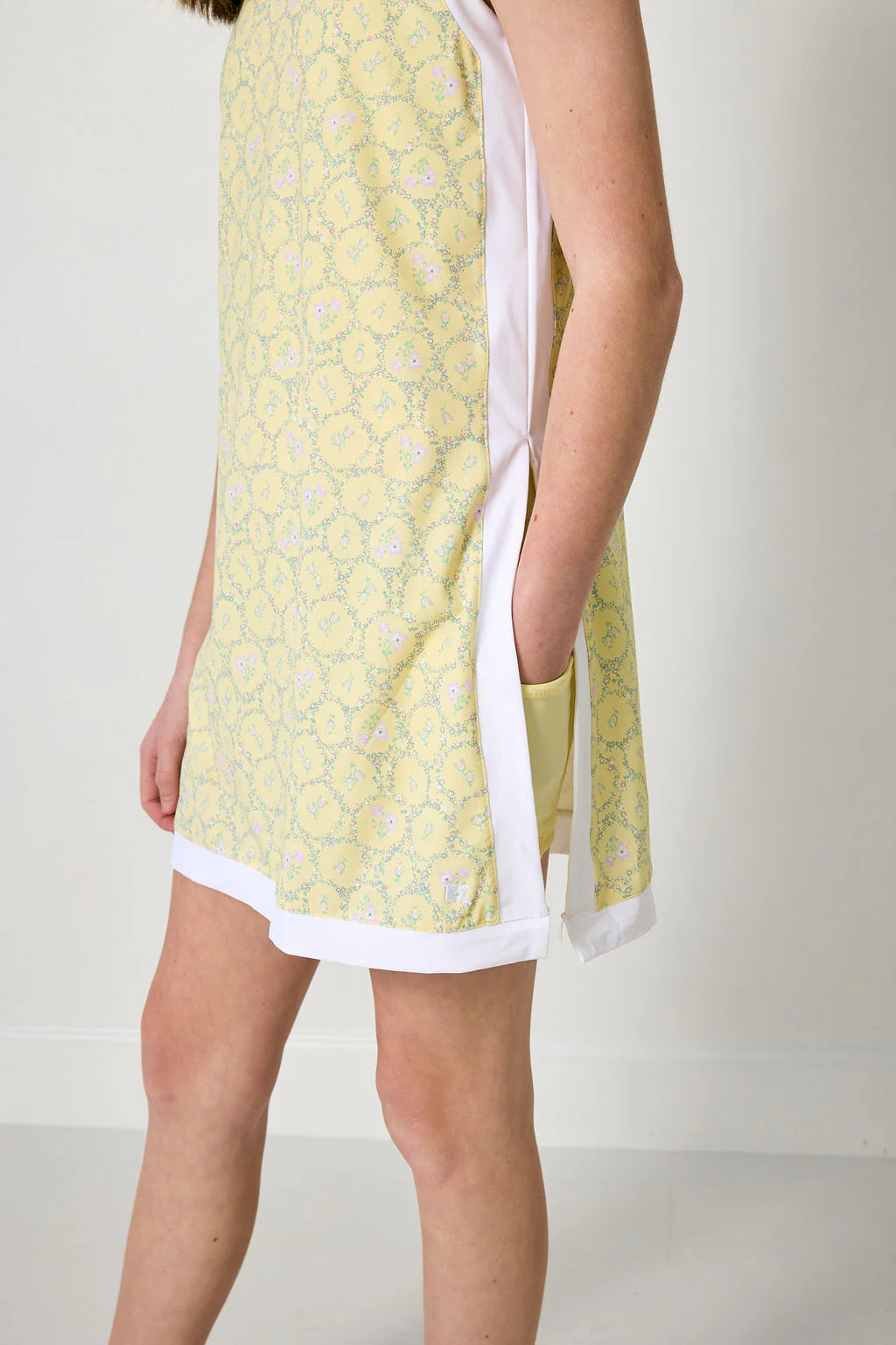 Courtside Kids Lemon Love Dress featuring bright yellow fabric and playful design for young children.