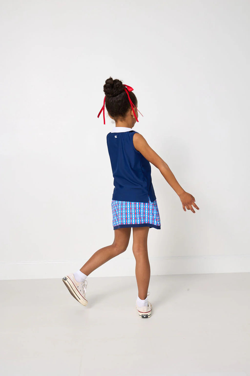 Red, white, and gingham retro power skort for kids by Courtside Kids, featuring a stylish and sporty design.