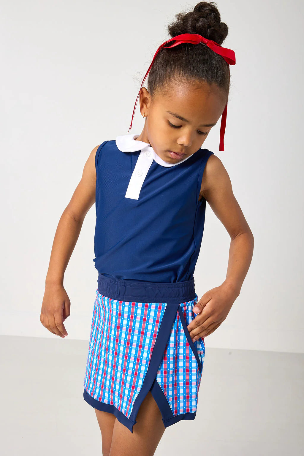Red, white, and gingham retro power skort for kids by Courtside Kids, featuring a stylish, sporty design with a comfortable fit.