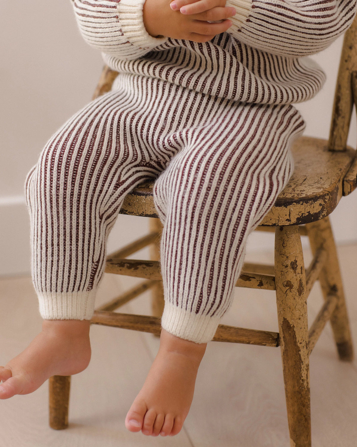 Black cherry striped relaxed knit sweater by Quincy Mae, featuring a cozy fit and soft fabric, shown in a front view.