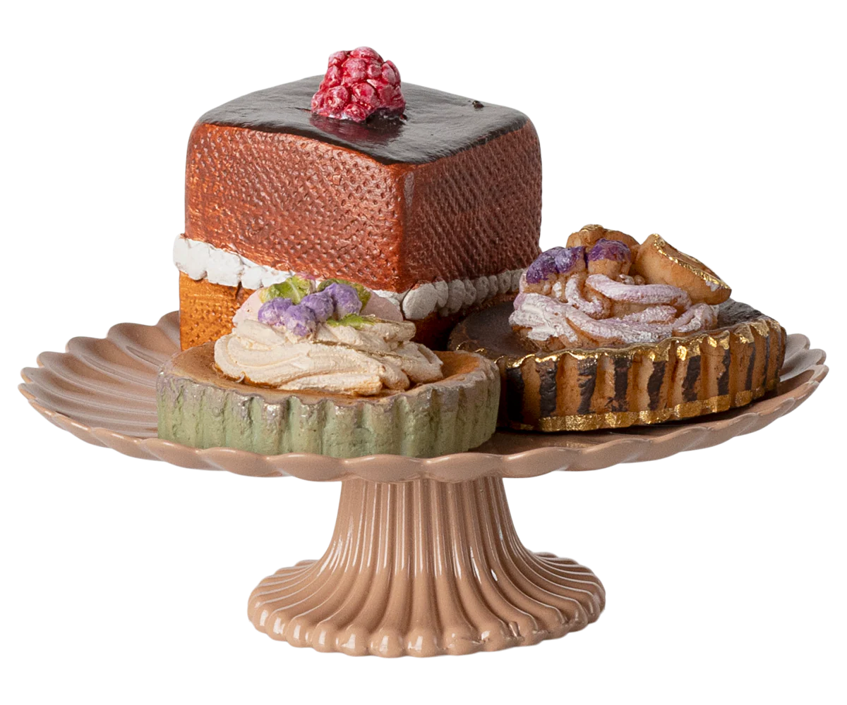 Mini Maileg cakes on a ceramic cakestand, featuring colorful miniature cake designs and decorative details, perfect for play or display.