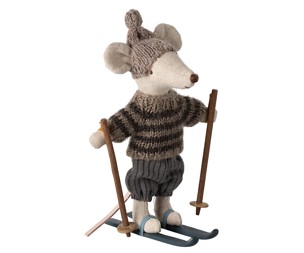 Grey winter mouse with ski set by Maileg, dressed as a big brother in cozy winter attire, holding skis and ready for snow fun.