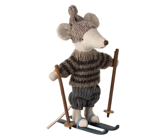 Grey winter mouse with ski set by Maileg, dressed as a big brother in cozy winter attire, holding skis and ready for snow fun.
