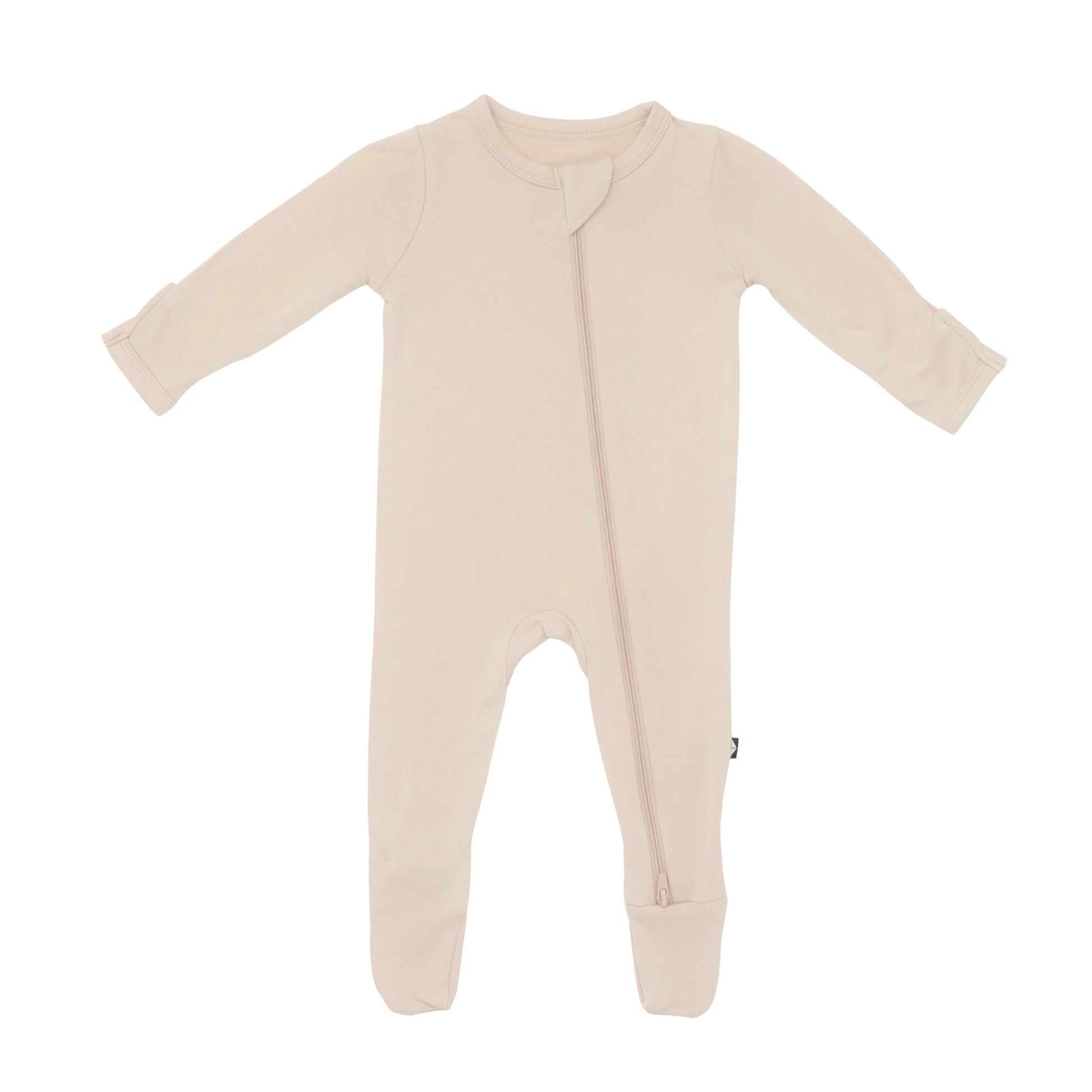 Kyte Baby zippered footie in Bisque, soft baby onesie with zipper closure, cozy and comfortable for infants.