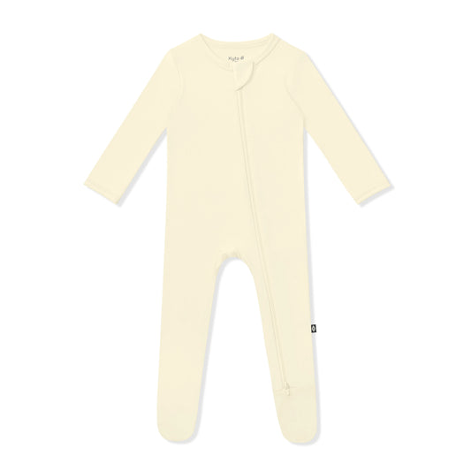 Kyte Baby zippered footie in chamomile, soft baby onesie with zipper closure, made from cozy, gentle fabric for infants.