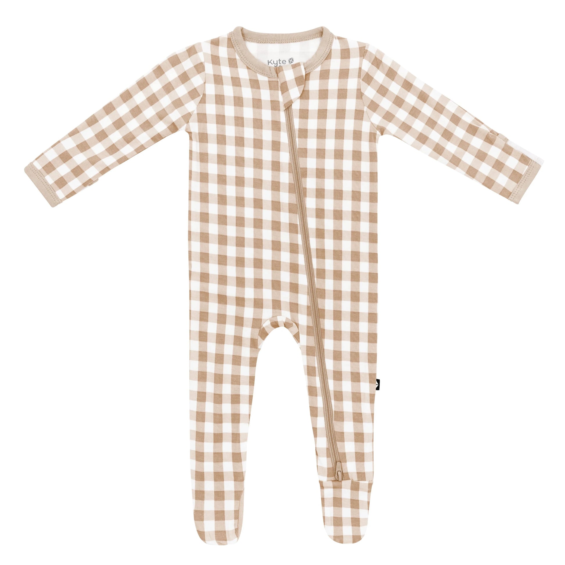 Kyte Baby zippered footie in gingham bisque fabric, featuring a full front zipper and soft, cozy material for infants.