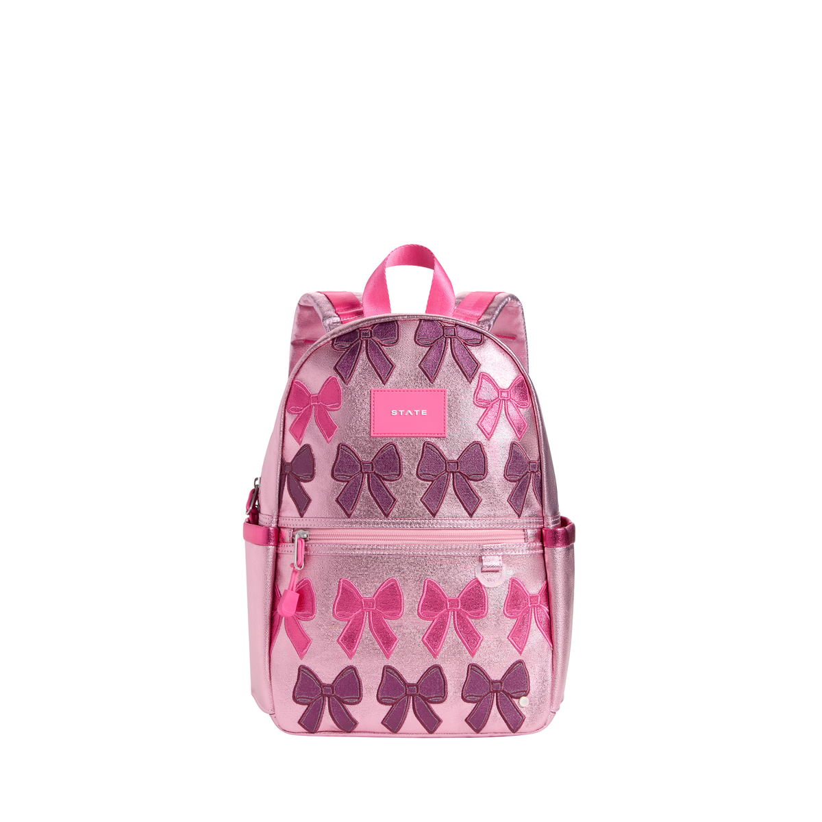 Patchwork Bows Kane Mini Backpack by State Bags featuring colorful bow patchwork design and compact, stylish silhouette.
