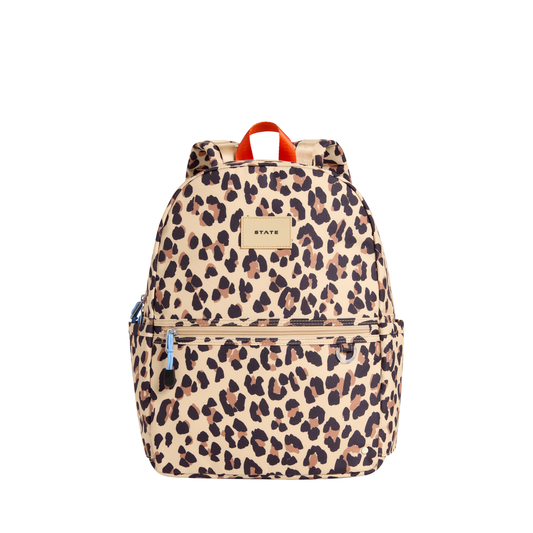 Leopard Kane backpack by State Bags with a leopard print design, featuring adjustable straps and multiple compartments.