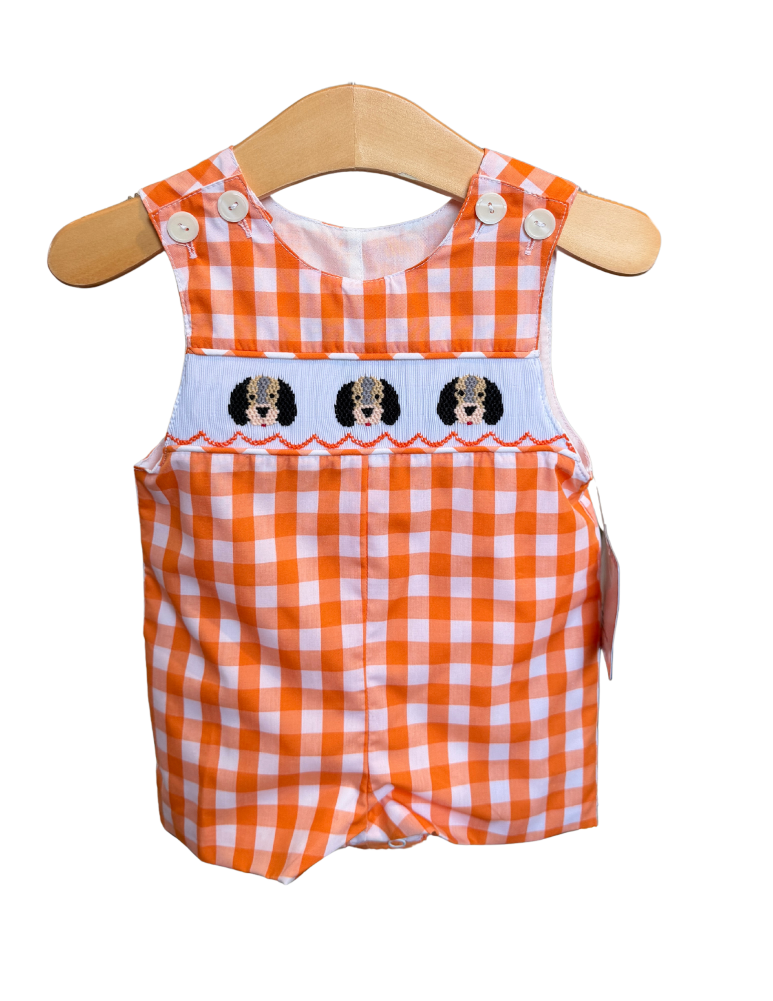 Orange and white gingham smocked smokey shortall for children by Remember Nguyen, featuring adjustable straps and a playful pattern.