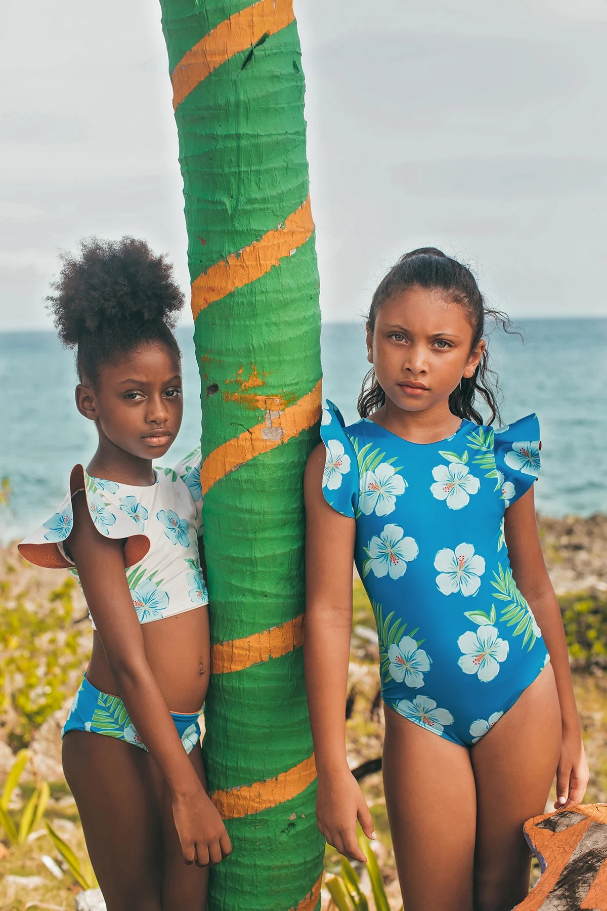 Pepita & Me Hibiscus Azul Dayana one-piece swimsuit with vibrant blue hibiscus floral pattern and fitted design.