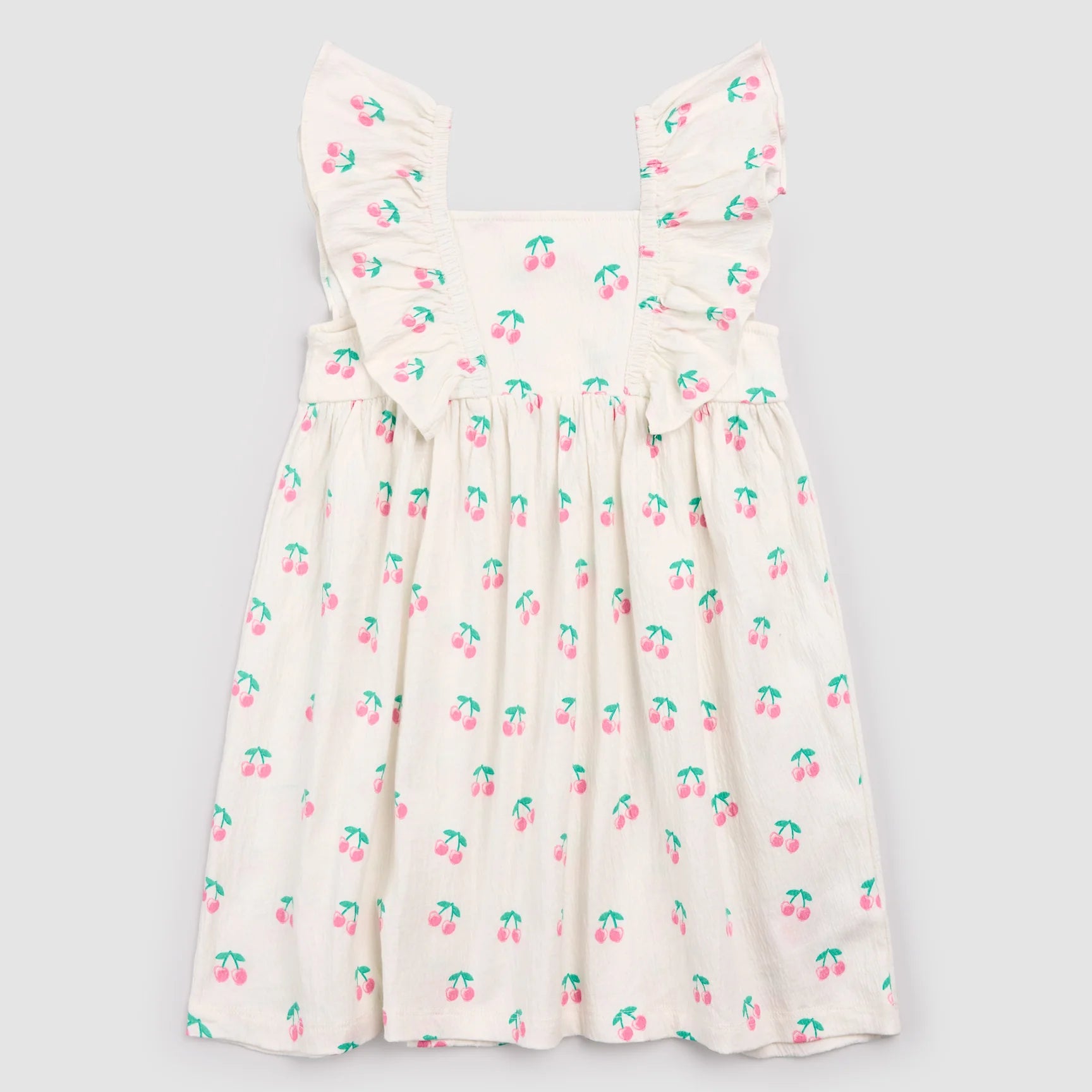 Cherries printed on ivory crinkle jersey fabric dress by Miles the Label, showcasing the full front design and fabric texture.