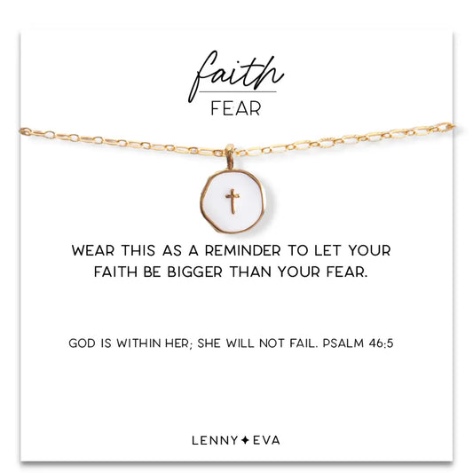 White enamel cross pendant with faith over fear message on gold chain, jewelry by Lenny & Eva.
