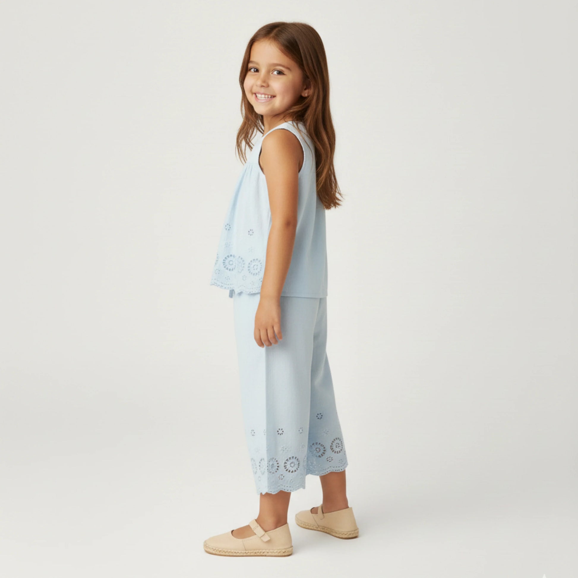 Light blue organic eyelet top and pants set by MakeMake, featuring eyelet details and a comfortable, stylish design.