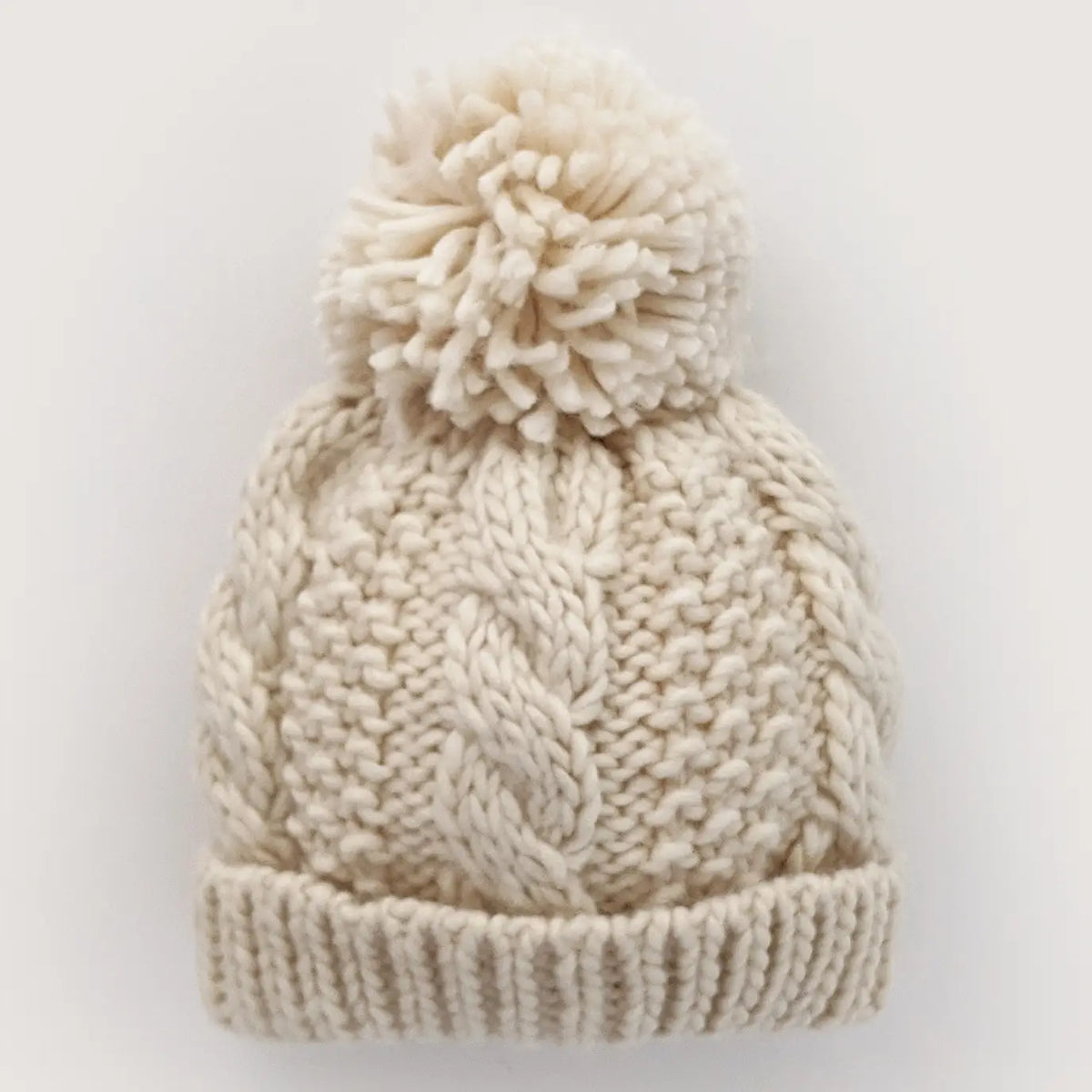 Huggalugs Natural Cable Beanie Baby for kids in soft, cozy knit with cable pattern, ideal for warm winter wear.