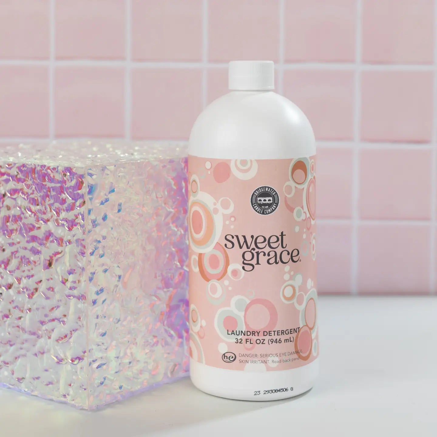 Sweet Grace 32oz laundry detergent bottle by Bridgewater Candle Company with a white label and blue cap.
