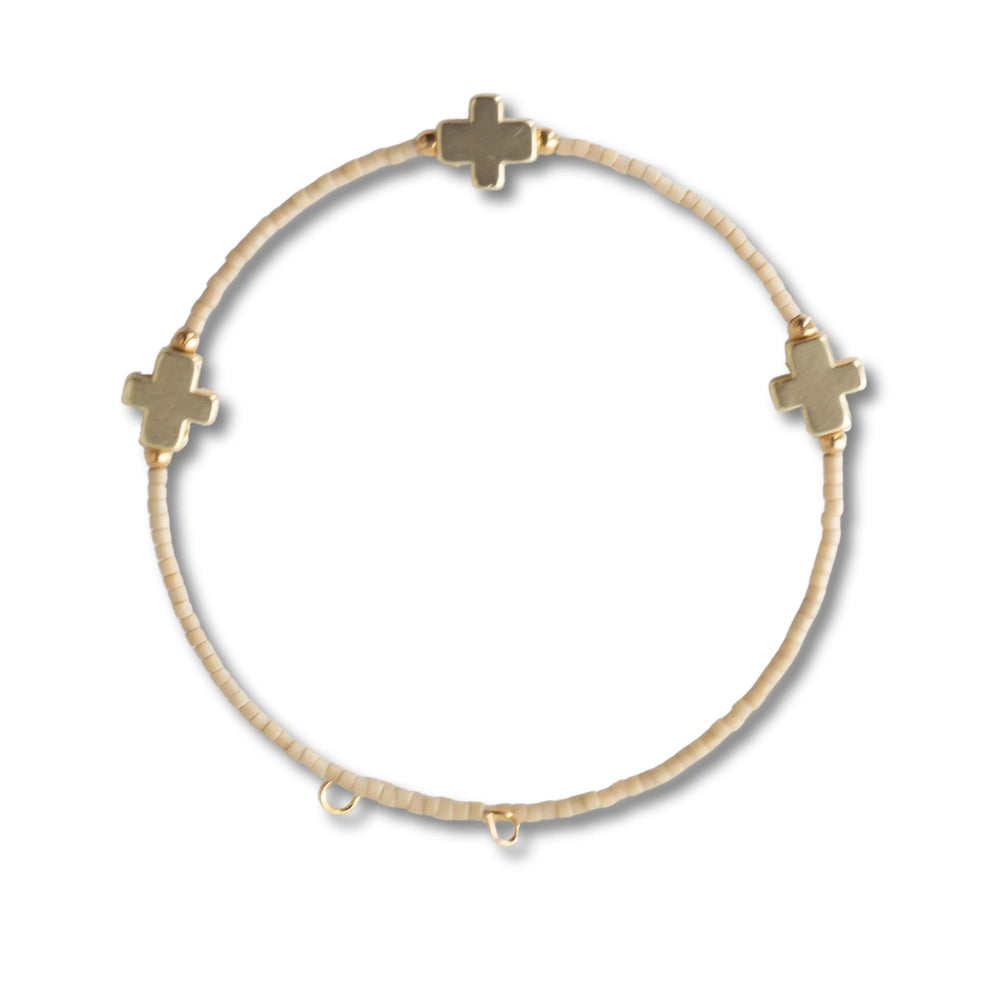 Set of Lenny & Eva Faithful Bangles featuring sleek, gold-toned metal jewelry with a smooth, polished finish.