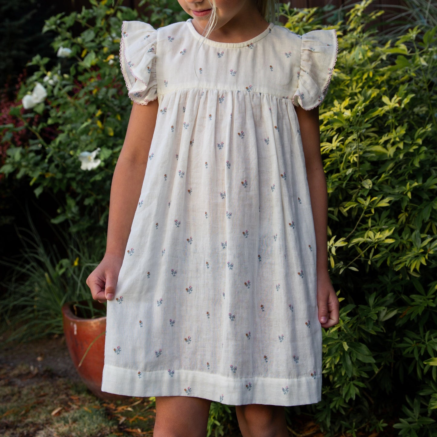 Petit Floret Girls Hannah Dress by Beet World with flutter sleeves, featuring a floral print and soft fabric for little girls.