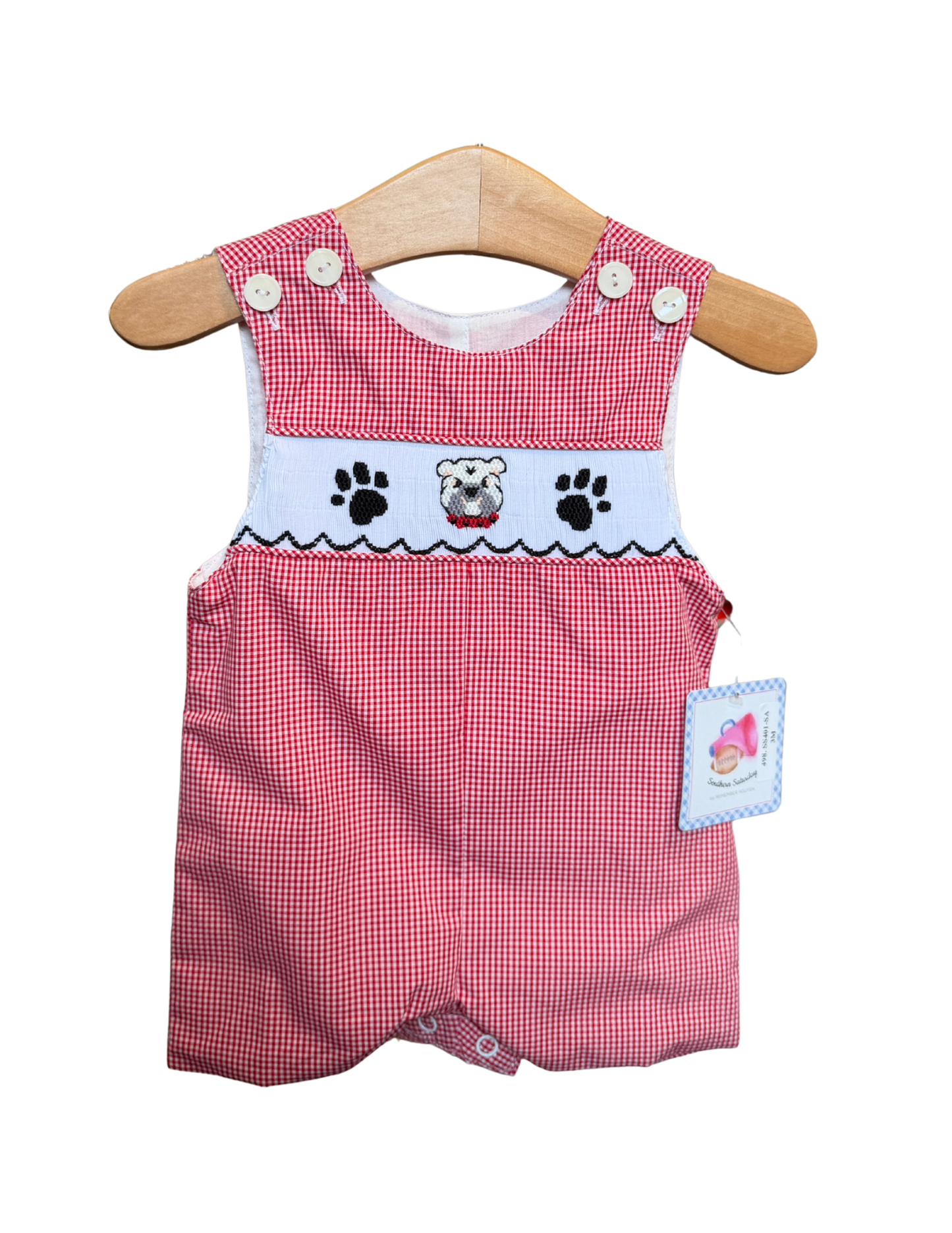 Red and white gingham smocked bulldog shortall for babies by Remember Nguyen, featuring a cute, classic checkered pattern.