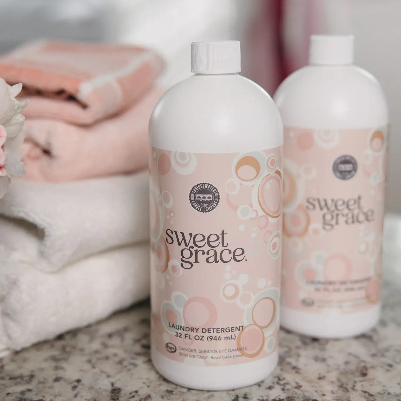 Sweet Grace 32oz laundry detergent bottle by Bridgewater Candle Company with a clean label and pink floral design.