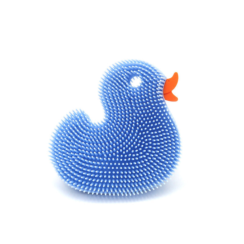 New People Squigee Duck silicone body scrub baby bath toy with soft yellow duck design and textured surface for gentle cleaning.