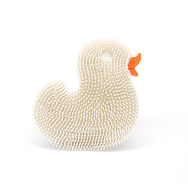 Squigee Duck silicone body scrub toy by New People, soft yellow bath toy with textured surface for gentle skin cleansing for babies